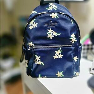 Kate Spade Navy Backpack with White Floral Pattern